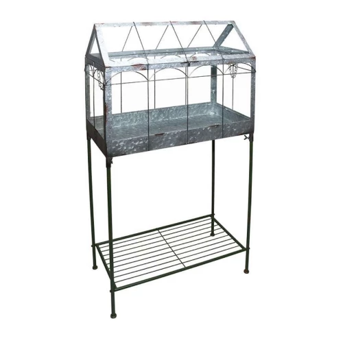 Mini greenhouse with iron frame and storage shelf – indoor plant display Mini greenhouse on tall stand with glass panels and metal frame