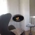 Ceiing-mounted bioethanol fireplace Cocoon Aeris Black with steel mounting rod